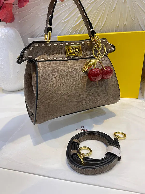شنطة فندي بنية بتعليقه كرز شنط وحقائب fendi bags