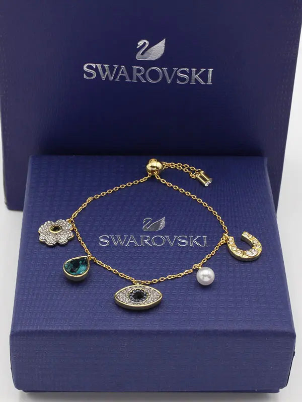 اسواره سواروفسكي نيو ايز لوقو اسواره Swarovski ذهبي