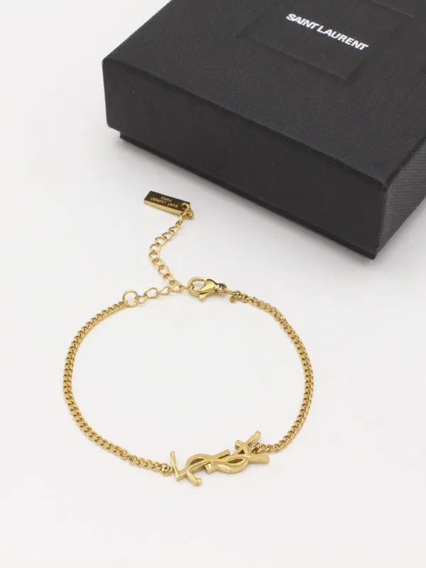 اسوارة ايف سان لوران سمبل شاين اسواره ysl ذهبي