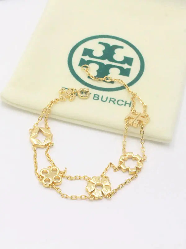 اسواره توري بورش 864 اسواره tory burch ذهبي
