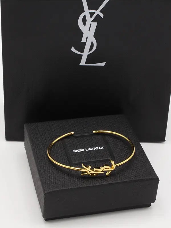 اساور ايف سان لوران ميتال لوقو اسواره ysl ذهبي