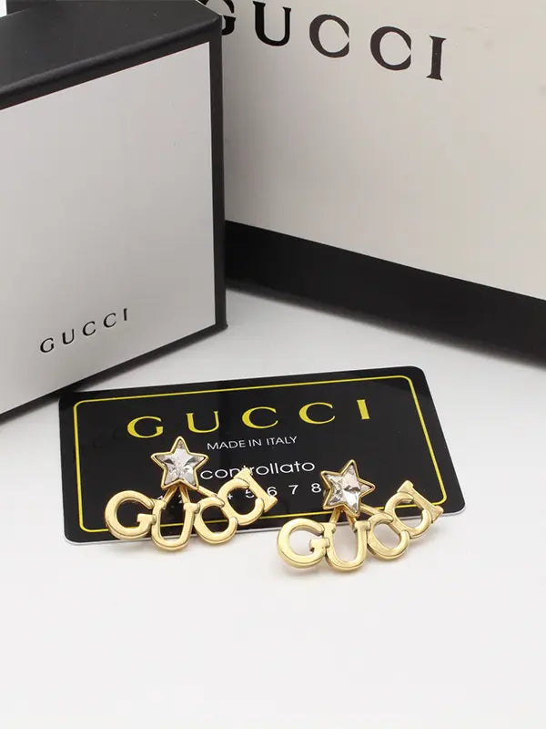 حلق قوتشي لوقو مطفي حلق gucci ذهبي