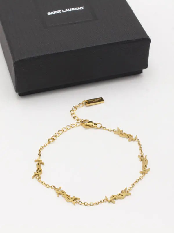 اسوارة ايف سان لوران سمبل ستايل اسواره ysl ذهبي