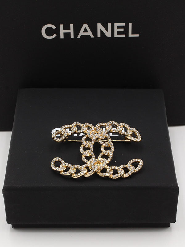 بروش شانيل جنزير كريستال بروش chanel ذهبي