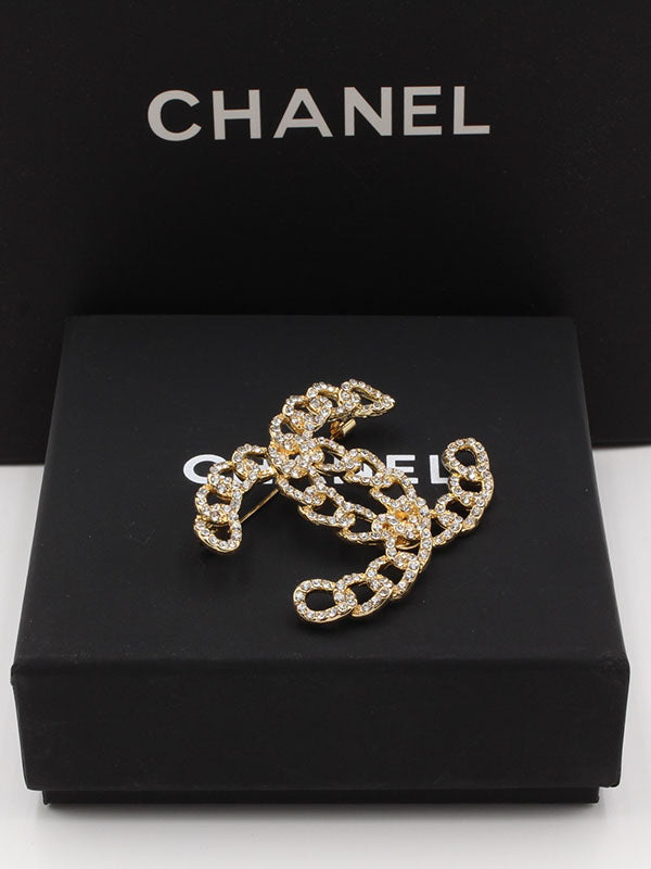 بروش شانيل جنزير كريستال بروش chanel