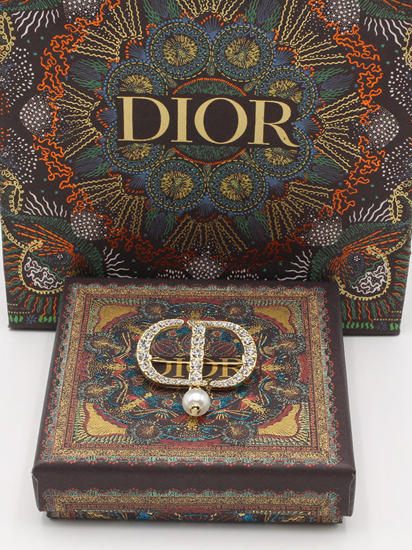 بروش ديور لول ذهبي بروش dior ذهبي