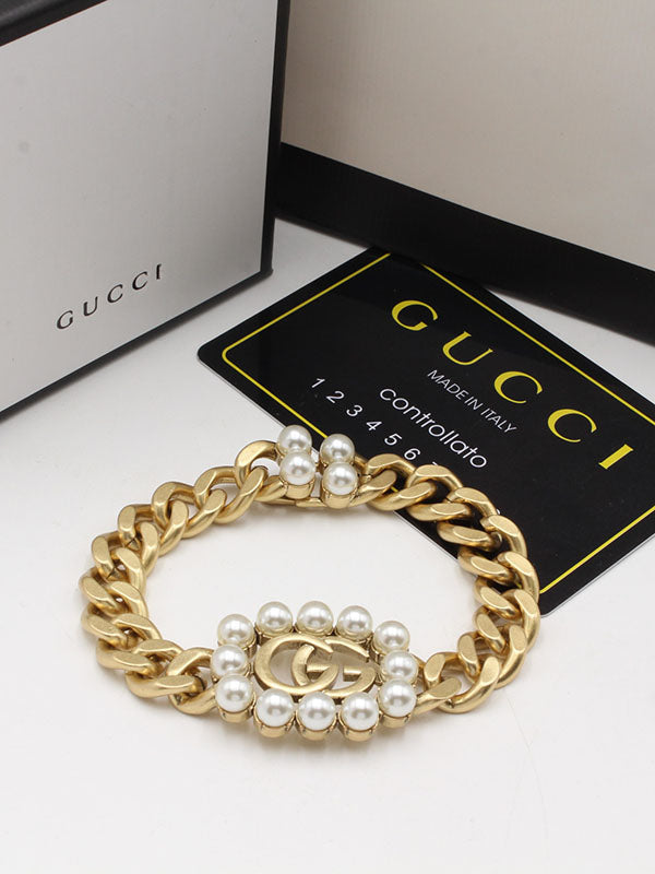 اساور قوتشي لولو بيرل لوقو برونز اسواره gucci ذهبي