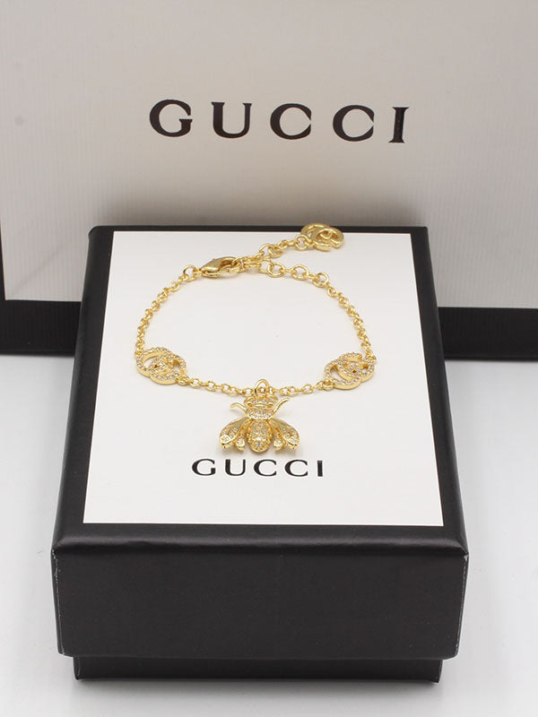 اساور قوتشي بترفلاي اسواره gucci ذهبي