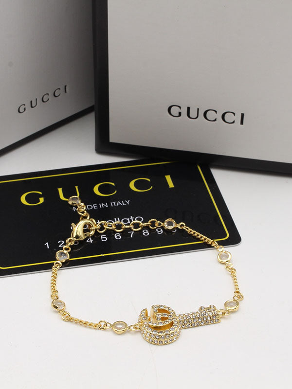اساور قوتشي سمبل كي لوقو اسواره gucci ذهبي