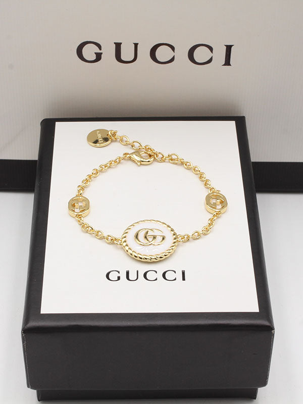 اساور قوتشي ابيض لوقو اسواره gucci ذهبي