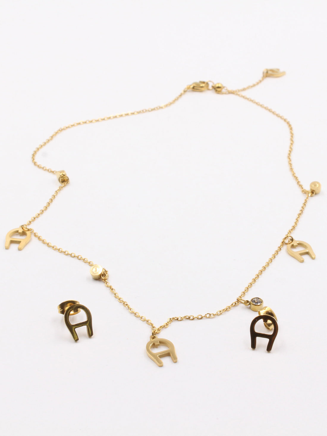 طقم اقنر ذهبي اطقم aigner