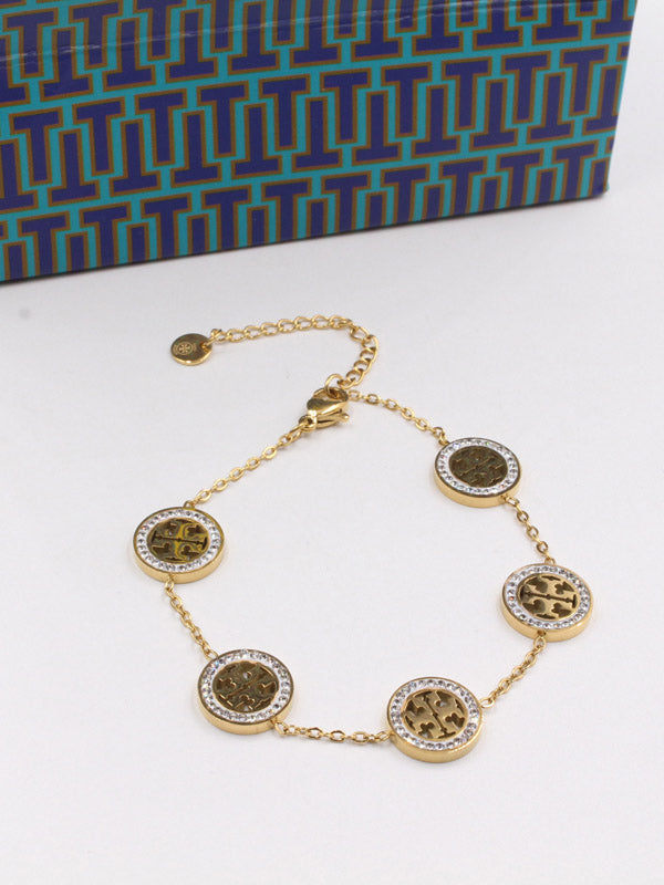 اسواره توري بورش كريستال مدور اسواره tory burch ذهبي