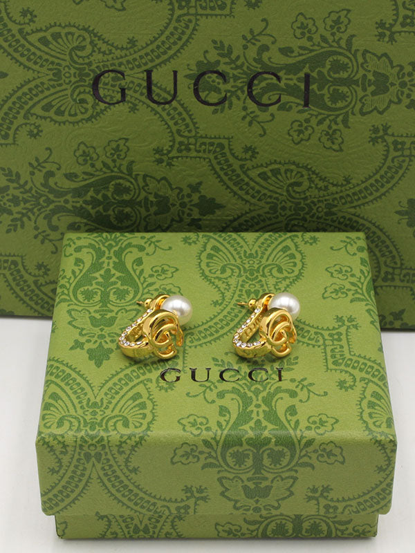 حلق قوتشي باك سايد بيرل لوقو حلق gucci ذهبي