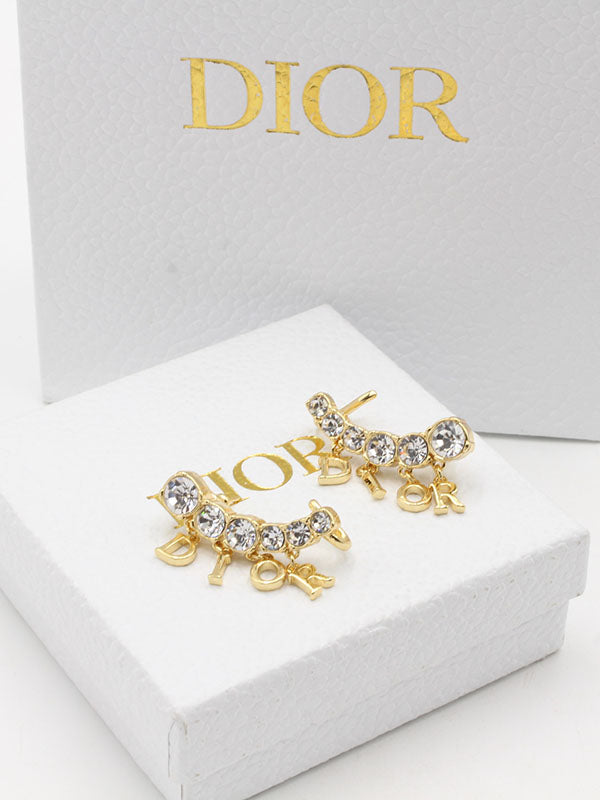 حلق ديور خلف الاذن لوقو حلق dior ذهبي