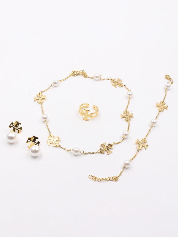 طقم توري بورش لولو 4 قطع اطقم tory burch ذهبي