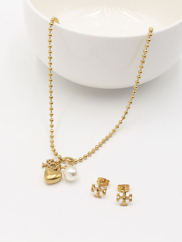 طقم توري بورش لوقو برونز اطقم tory burch