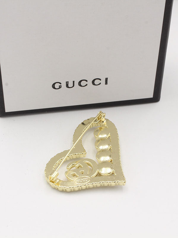 بروشات قوتشي بروش gucci ذهبي