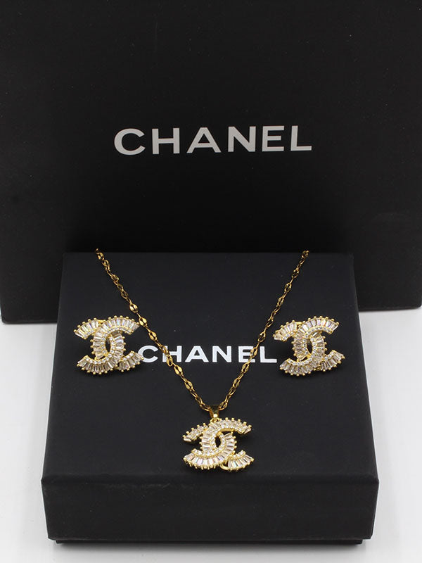 طقم شانيل زركون كيوبك ذهبي اطقم chanel ذهبي
