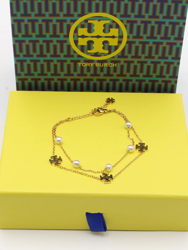 اسواره توري بورش لولو دورين اسواره tory burch ذهبي