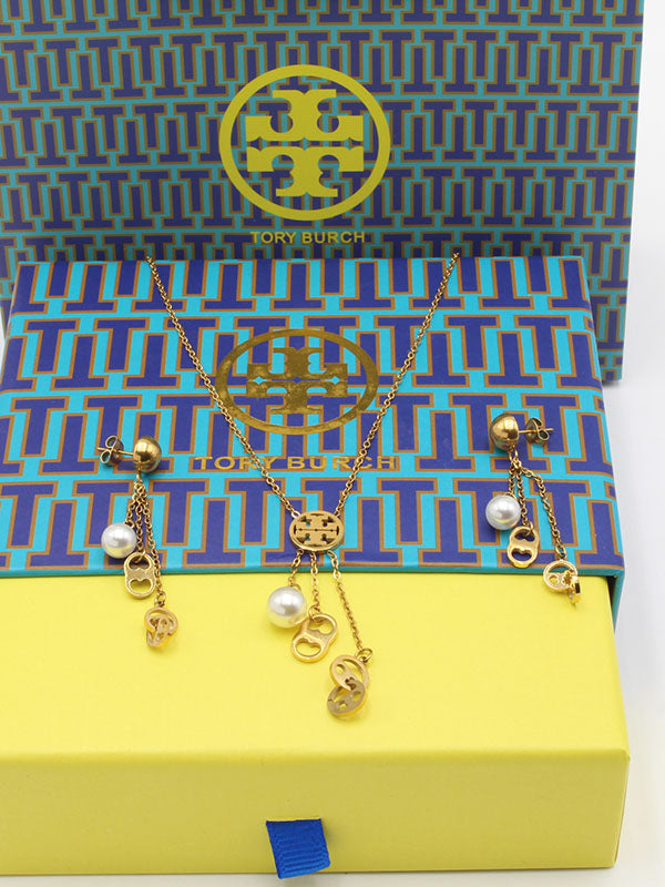 طقم توري بورش لولو لونق بندنت اطقم tory burch ذهبي
