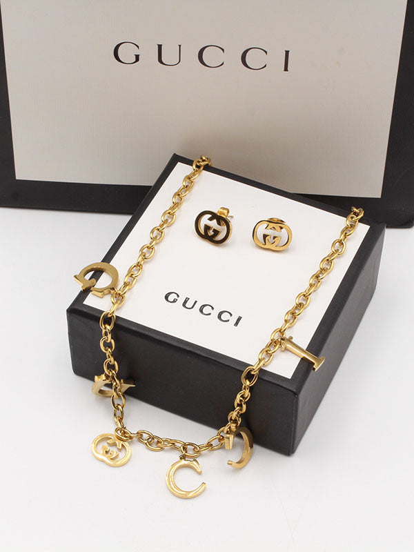 طقم قوتشي لوقو 2 قطع اطقم gucci ذهبي