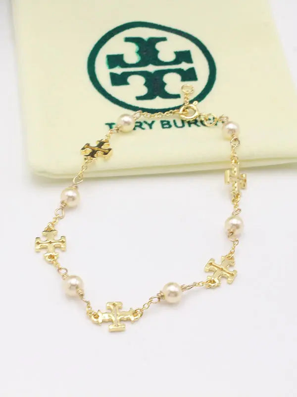 اسوارة توري بورش بيرلز ماستر اسواره tory burch