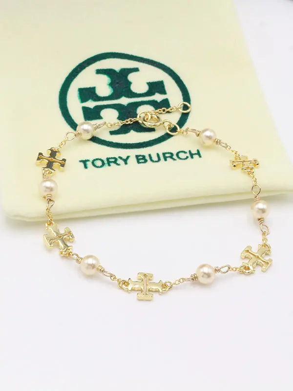 اسوارة توري بورش بيرلز ماستر اسواره tory burch ذهبي