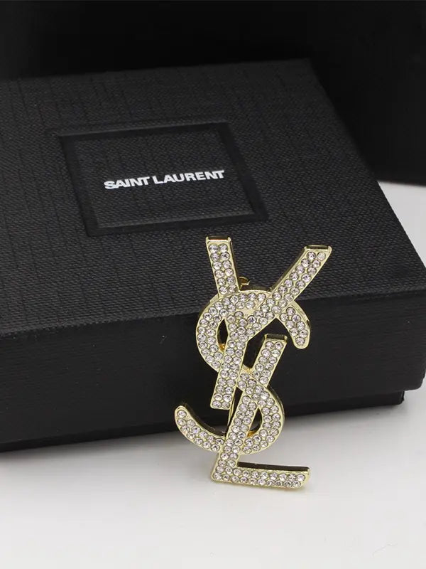 بروش ايف سان لوران كريستال وسط بروش ysl ذهبي