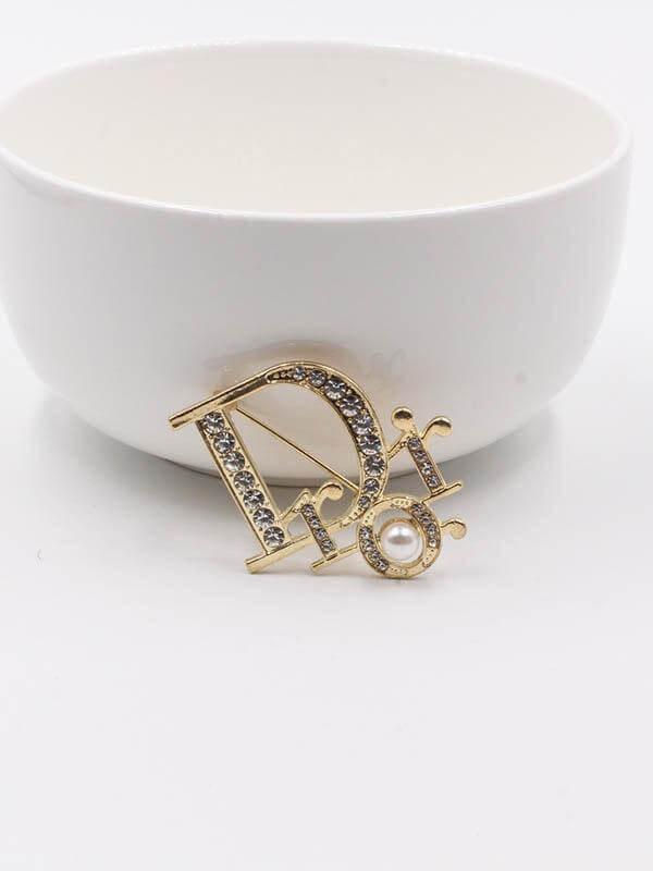 بروشات ديور بروش dior ذهبي