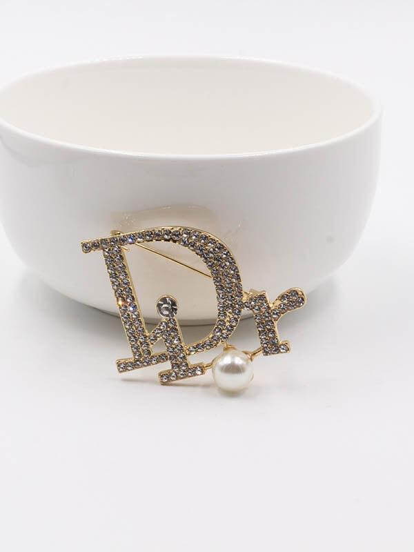 بروش ديور بروش dior ذهبي