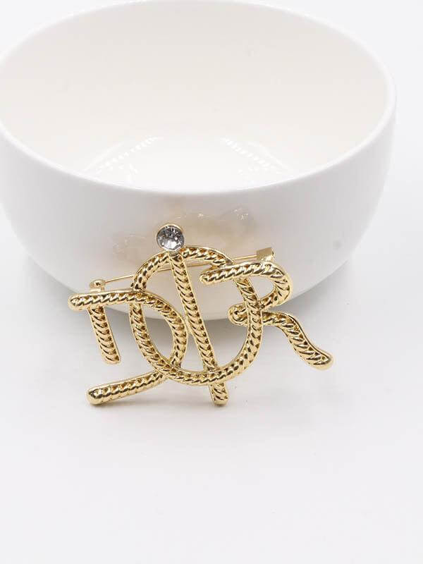 بروش ديور ذهبي بروش dior ذهبي