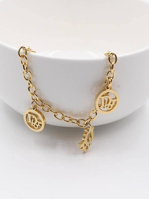 اسوارة كرستيان ديور ذهبية اسواره dior