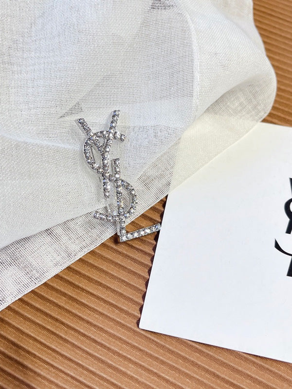 بروش ماركة ايف سان لوران كريستال بروش ysl فضي