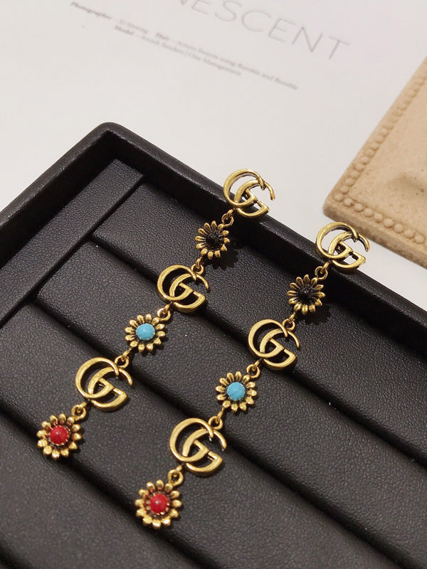 حلق قوتشي طويل حجر طبيعي حلق gucci ذهبي