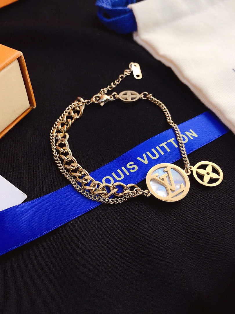 اساور لويس فيتون قولد اند وايت شيل اسواره louis vuitton ذهبي