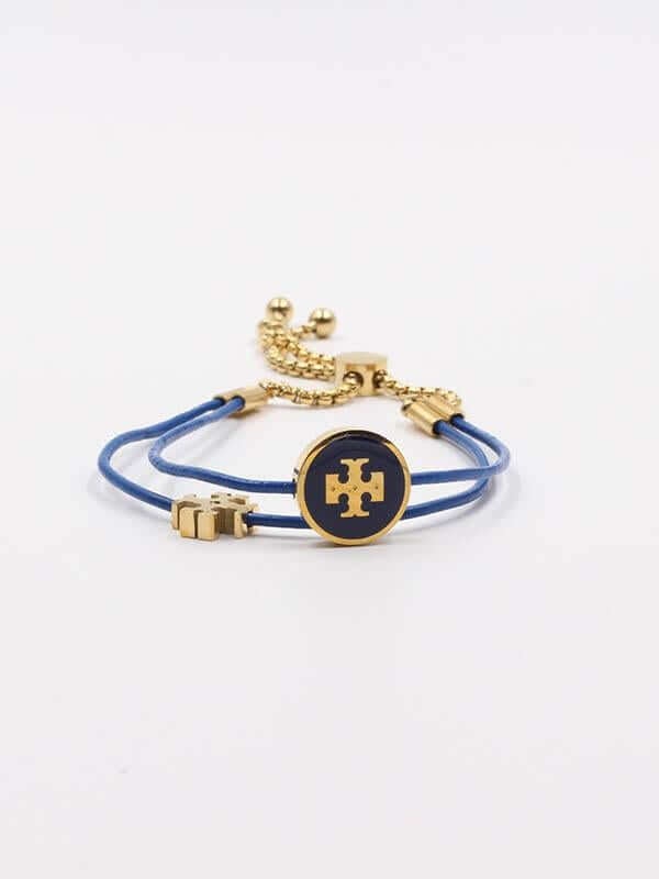 اسواره توري بورش سلايدر كيرا اسواره tory burch ازرق ذهبي