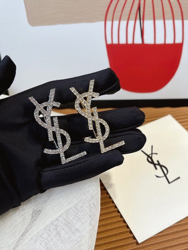 بروش ماركة ايف سان لوران كريستال بروش ysl