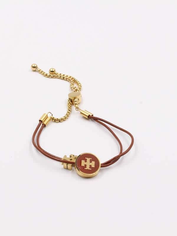 اسواره توري بورش سلايدر كيرا اسواره tory burch بني ذهبي