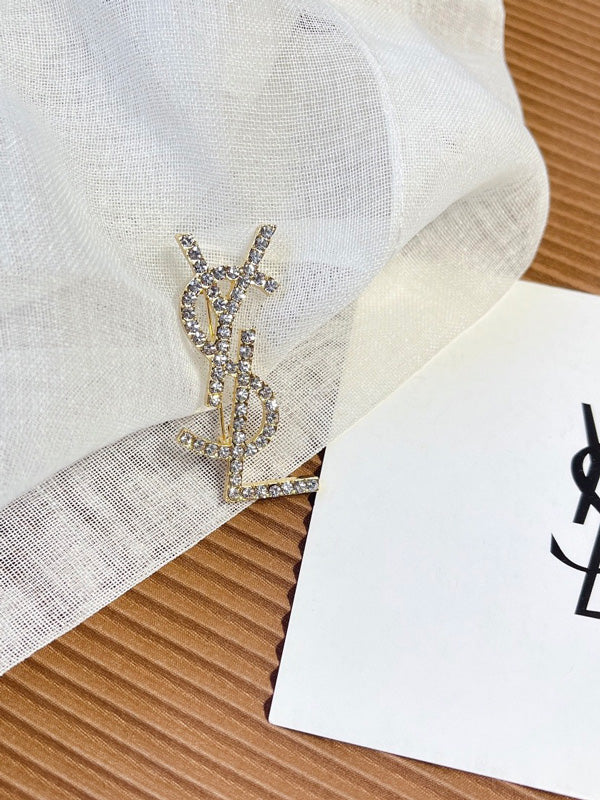 بروش ماركة ايف سان لوران كريستال بروش ysl ذهبي