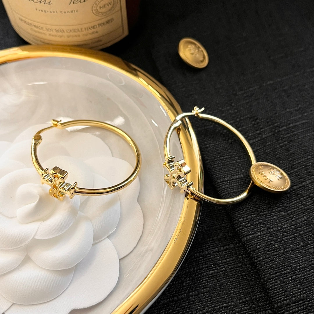 حلق توري بورش مدور كبير ميتال حلق tory burch ذهبي