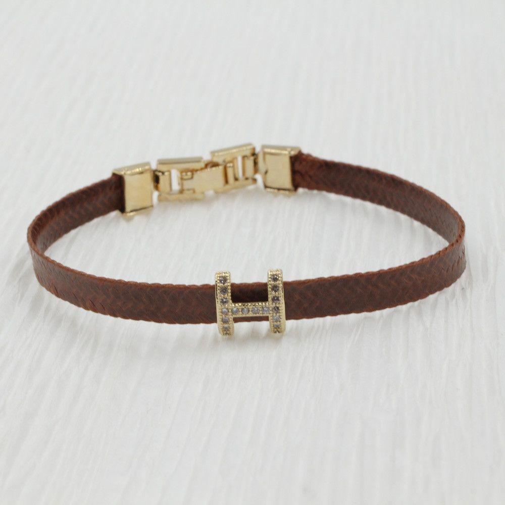 اسواره هيرمز جلد اسواره HERMES بني ذهبي