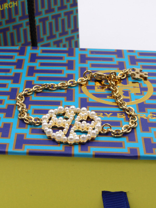 اساور توري بورش لولو دائرية اسواره tory burch