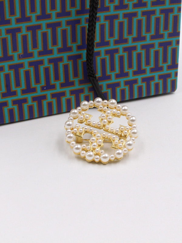 بروش توري بورش لولو دائري بروش tory burch ذهبي