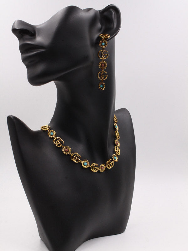 طقم قوتشي احجار ملونه ذهبي اطقم gucci