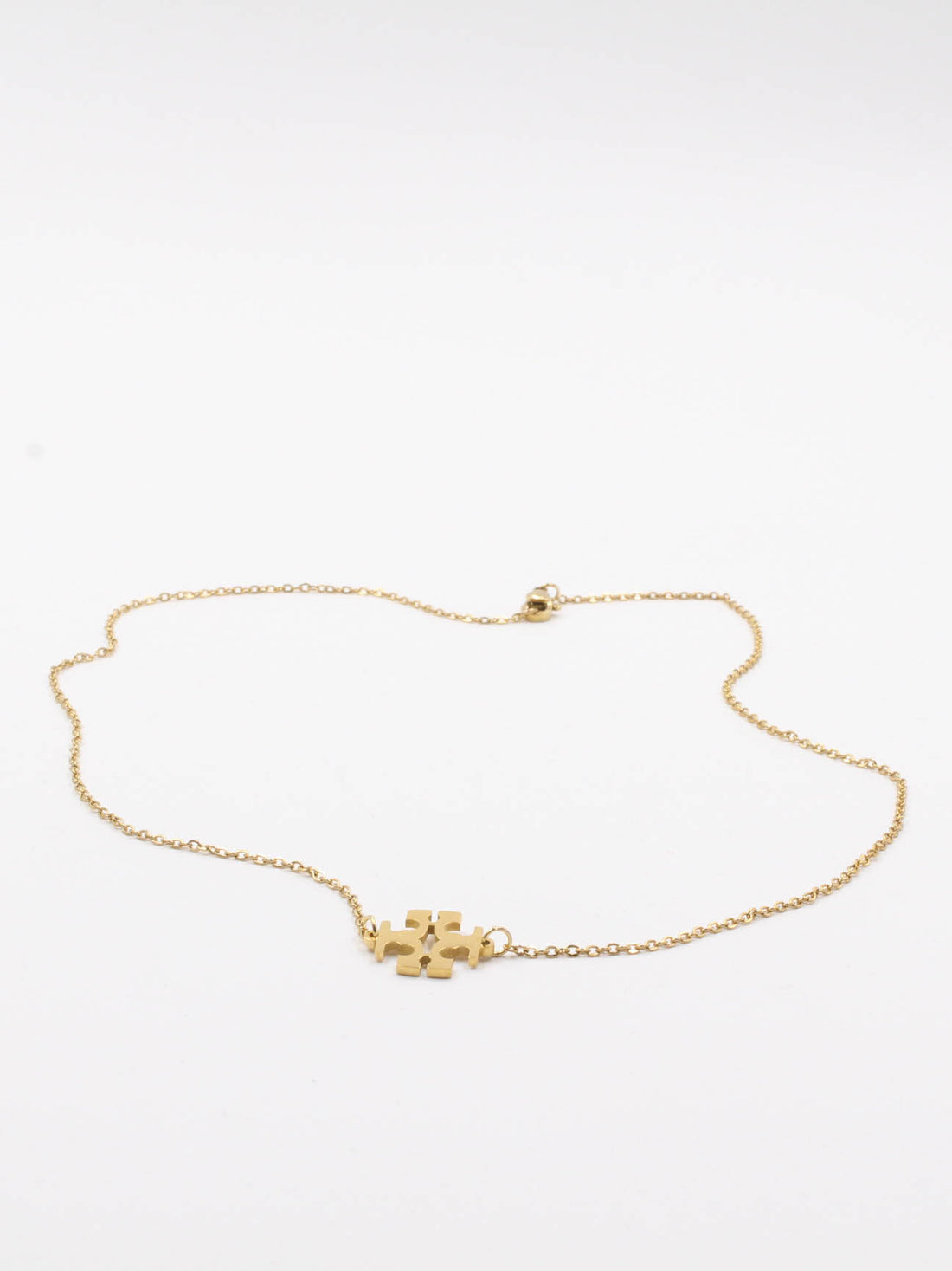 سلسال توري بورش ذهبي ناعم سلسال tory burch ذهبي