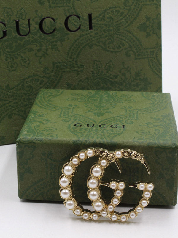 بروش ماركة قوتشي لولو بروش gucci ذهبي