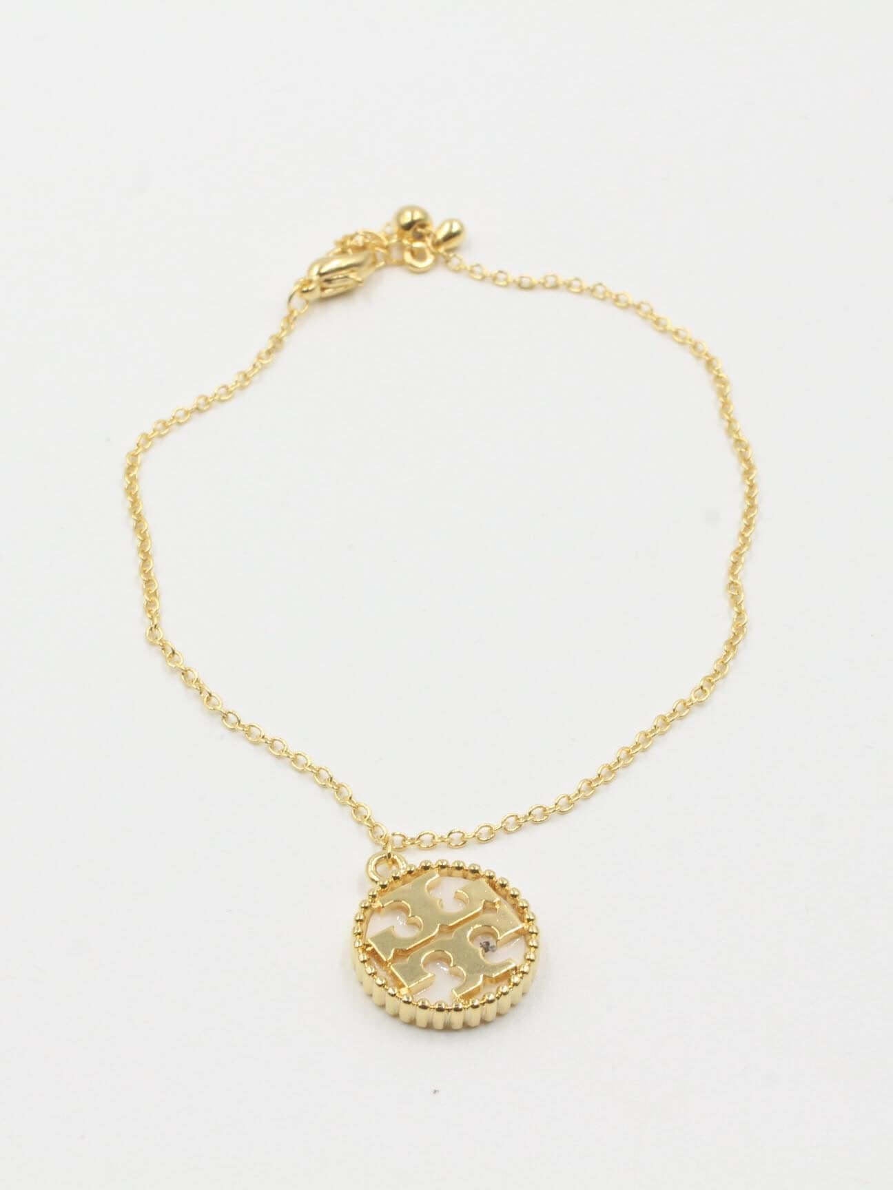 اسواره توري بورش اسواره tory burch ابيض ذهبي