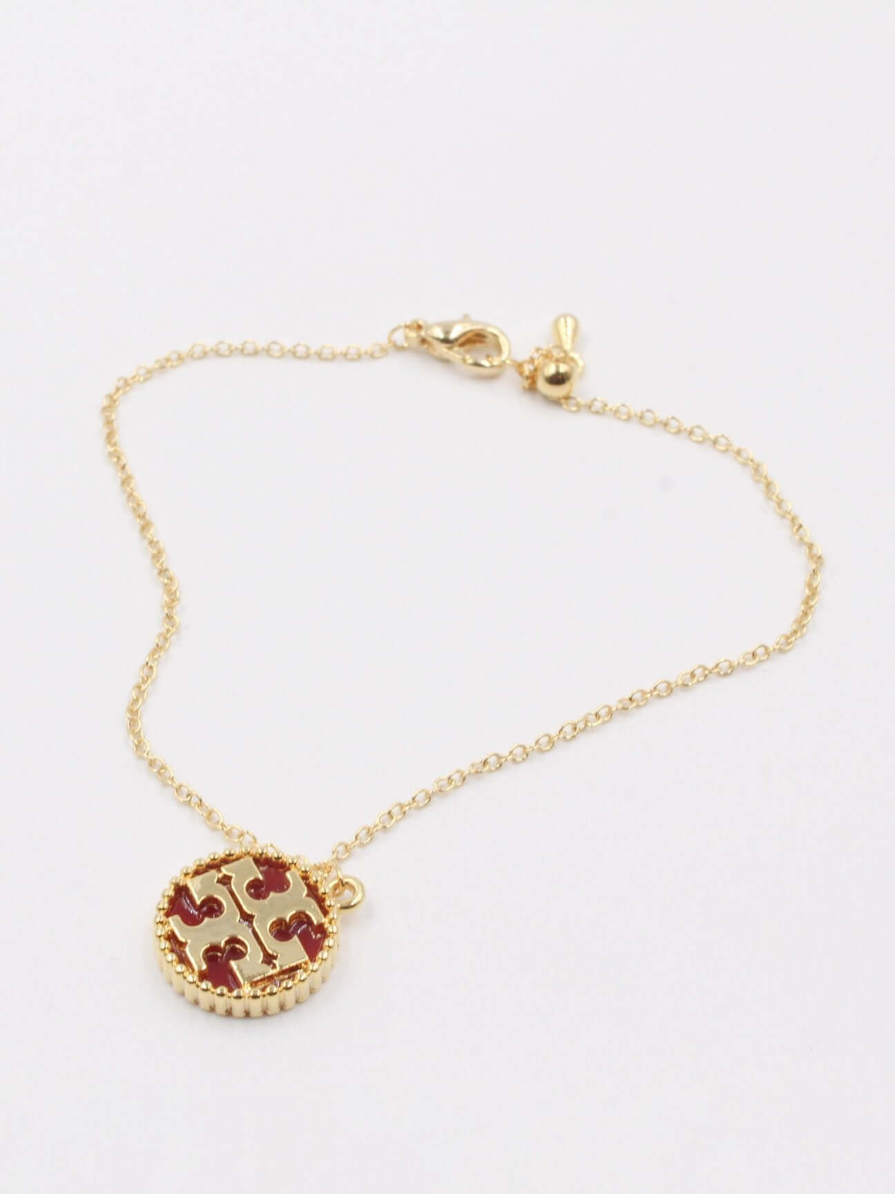 اسواره توري بورش اسواره tory burch احمر ذهبي