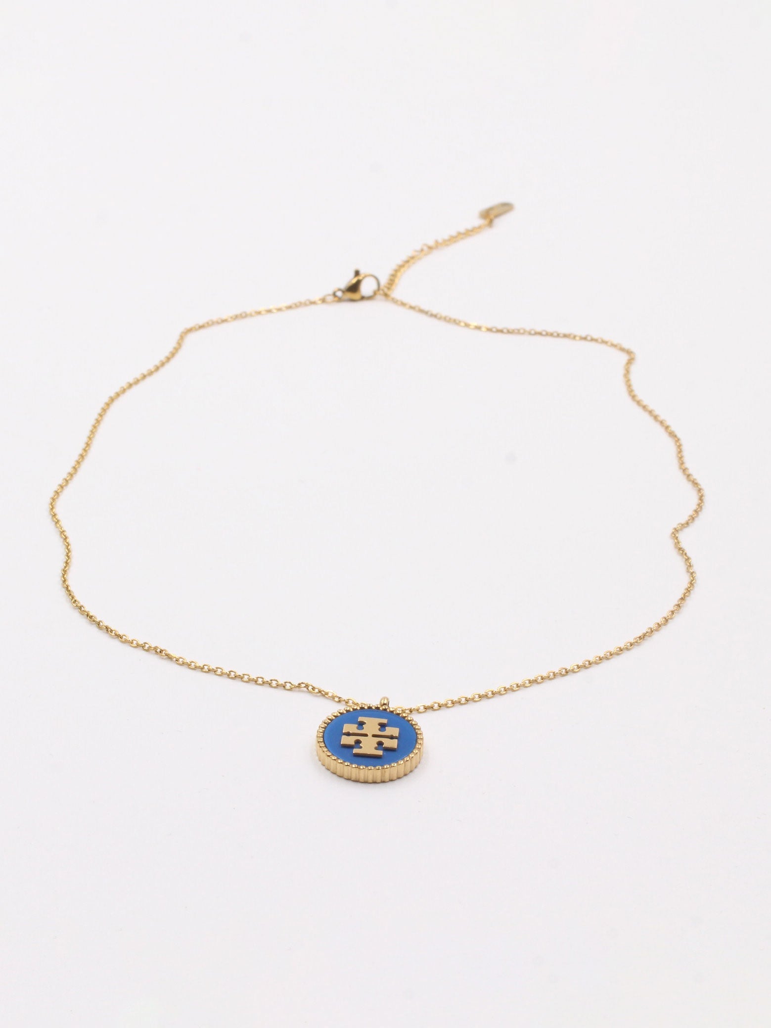 سلسال توري بورش سلسال tory burch ازرق ذهبي