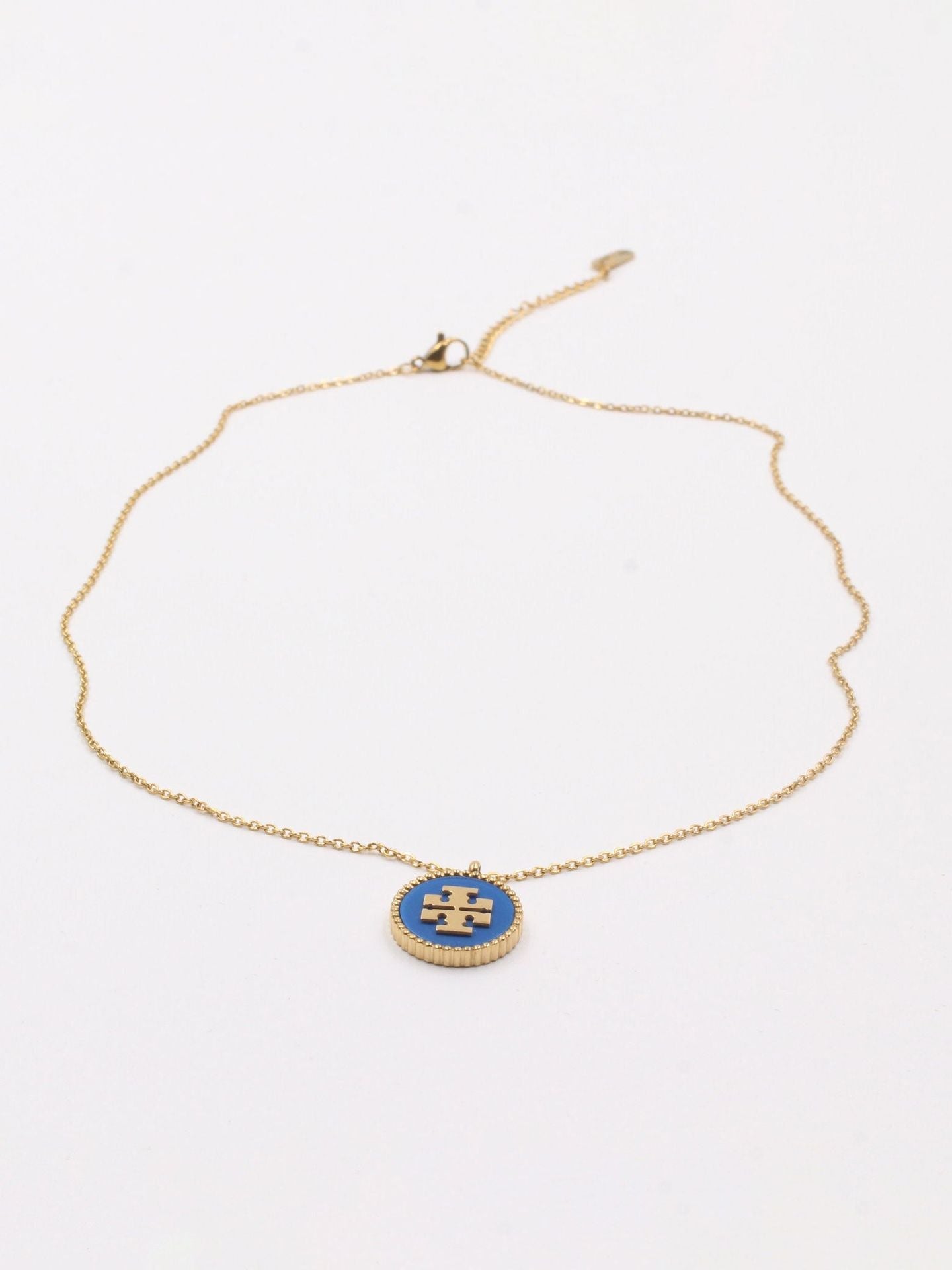 سلسال توري بورش سلسال tory burch ازرق ذهبي
